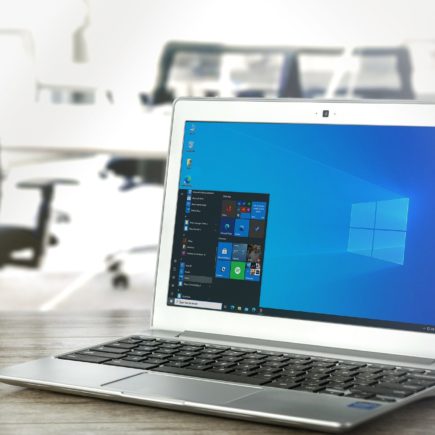 A laptop on a desk showing the desktop of a windows operating system ready to set up Bing Webmaster Tools